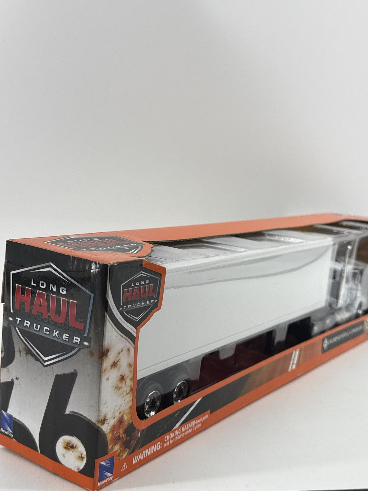 New-Ray Int'l Lonestar Trucker 1:43 Diecast Truck & Trailer
